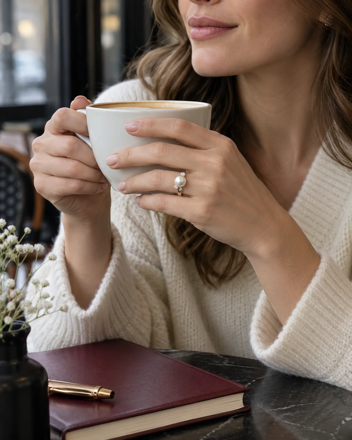 EMBED ring worn at a cafe