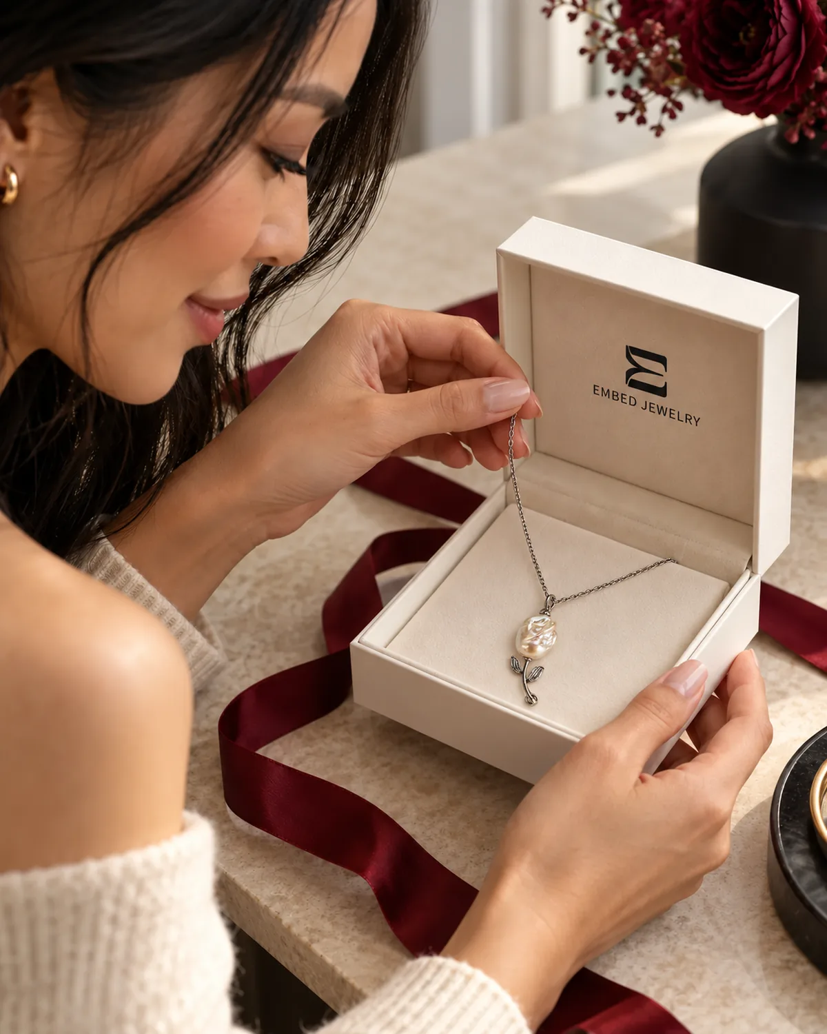 Opening an EMBED jewelry gift box